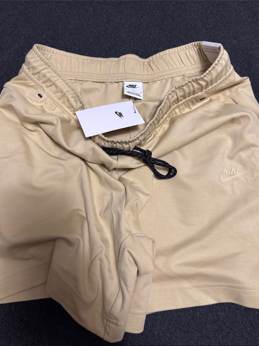 Nike Men's Large Cream Athletic Fleece Shorts with Black accents.